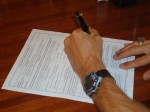 Uncle Brock signing Andy's official commission papers.