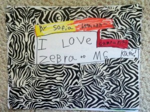 This work of art is a book with facts about zebras,beautiful illustrations, and a cover made with pieced together zebra duct tape.
